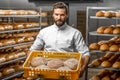 Baker holding breads at the manufacturing