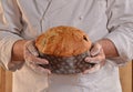 Baker holding panettone