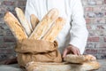 Baker holding traditional bread french baguettes Royalty Free Stock Photo