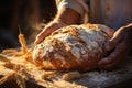 A baker holds freshly baked bread