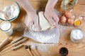 Baker knead dough bread, pizza or pie recipe ingredients with hands, food on kitchen table background, working with milk, yeast, f Royalty Free Stock Photo