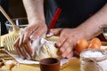 Baker knead dough bread, pizza or pie recipe ingredients with hands, food on kitchen table background, working with milk, yeast, f Royalty Free Stock Photo