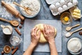 Baker knead dough bread, pizza or pie recipe ingridients with hands, food flat lay Royalty Free Stock Photo