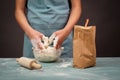 Baker kneading dough for artisan bread or pizza with his hands, prepare ingredients for food, baking pastry Royalty Free Stock Photo