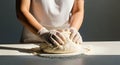 Baker Kneading Dough with Gloves, Close-up of Hands Making Bread, Baking Process Royalty Free Stock Photo