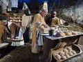 Baker make bread during a historical re-enactment in the caves of Villaga, Italy