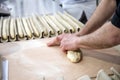 The baker makes the dough for crispy French baguettes