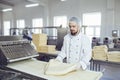 A baker makes the dough on the equipment in the bakery