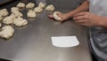 Baker making bagel