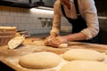 Baker making bread dough at bakery kitchen Royalty Free Stock Photo