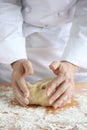 Baker making bread, kneading a dough Royalty Free Stock Photo