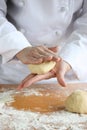 Baker making bread, kneading a dough Royalty Free Stock Photo