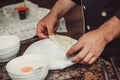 Baker making turkish pita bread in his bakery. Baking process bread. Royalty Free Stock Photo