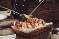 Baker making turkish pita bread in tandoor, clay oven. Baking process. Royalty Free Stock Photo