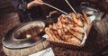 Baker making turkish pita bread in tandoor clay oven. Baking process. Royalty Free Stock Photo