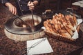 Baker making turkish pita bread in tandoor clay oven. Baking process. Royalty Free Stock Photo