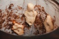 Baker making turkish pita bread in tandoor clay oven. Baking process.