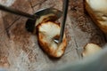 Baker making turkish pita bread in tandoor, clay oven. Baking process. Many fresh hot bread in the basket. Royalty Free Stock Photo