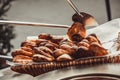 Baker making turkish pita bread in tandoor, clay oven. Baking process. Many fresh hot bread in the basket. Royalty Free Stock Photo