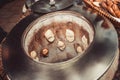 Baker making turkish pita bread in tandoor, clay oven. Baking process. Many fresh hot bread in the basket. Royalty Free Stock Photo