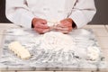 Baker Pinching Dough Royalty Free Stock Photo