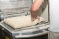 The baker prepares bread dough