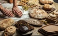 Man rolling out dough on kitchen table, close up Royalty Free Stock Photo