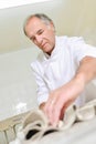 Baker prepring bread for oven