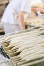 Baker prepring bread for oven