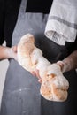 Baker presenting a fresh loaf of bread or baguette Royalty Free Stock Photo