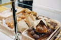 The baker put dough products on the table to be served