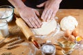 Baker rolling dough with flour bread, pizza or pie recipe ingredients with hands, food on kitchen table background, working with m Royalty Free Stock Photo