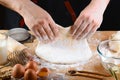 Baker rolling dough with flour bread, pizza or pie recipe ingredients with hands, food on kitchen table background, working with m Royalty Free Stock Photo