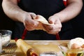 Baker rolling dough with flour bread, pizza or pie recipe ingredients with hands, food on kitchen table background, working with m Royalty Free Stock Photo