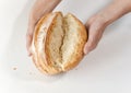 Baker's hands with broken white bread