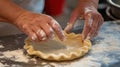 Baker's hands crimping pie crust in kitchen Royalty Free Stock Photo