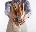 Baker`s hands hold fresh bread