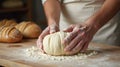 Baker\'s Hands Kneading Dough in a Flour-Dusted Kitchen Setting Royalty Free Stock Photo