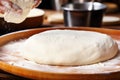 Baker\'s hands meticulously knead dough