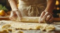 A Baker\'s Hands Rolling Out Dough on a Floured Surface Royalty Free Stock Photo