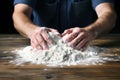 Baker\'s hands skillfully knead dough for delightful creations