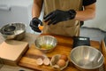 Baker separating eggs preparing for a delicious batch of homemade cookies Royalty Free Stock Photo