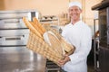 Baker showing basket of bread Royalty Free Stock Photo