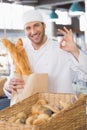 Baker showing basket of bread Royalty Free Stock Photo