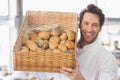 Baker showing basket of bread Royalty Free Stock Photo