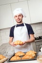 Baker showing croissant