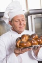 Baker showing freshly baked loaf Royalty Free Stock Photo