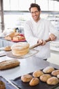 Baker showing freshly baked loaf Royalty Free Stock Photo