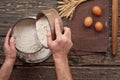 Baker sift the flour to make bread Royalty Free Stock Photo