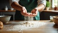 Baker sifting flour with hands in a rustic kitchen. Royalty Free Stock Photo